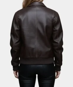 Back view of the Sydney Sweeney The Housemaid jacket, a premium dark brown leather bomber with detailed stitching and a ribbed waist for Millie.