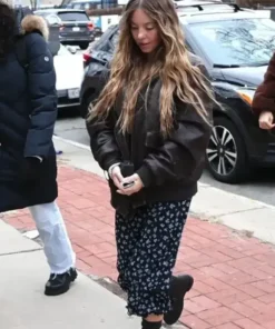 Sydney Sweeney The Housemaid black bomber leather jacket with ribbed cuffs, captured during a filming break for the upcoming 2025 thriller.
