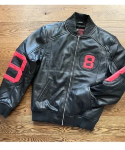 A sleek 8 Ball Bomber Jacket Black featuring vibrant red leather sleeves and bold circular graphics.