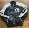 A sleek 8 Ball Bomber Jacket in black leather with stark white circular graphics and trim.