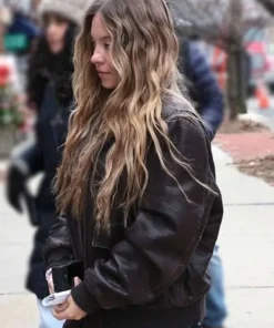 Sydney Sweeney black leather bomber jacket worn on set, featuring an oversized vintage fit for her role in the 2025 film The Housemaid.