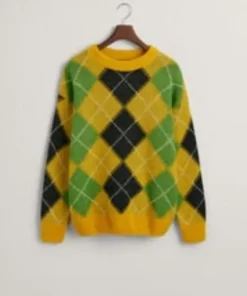 A yellow fuzzy argyle sweater displayed on a hanger against a plain background.