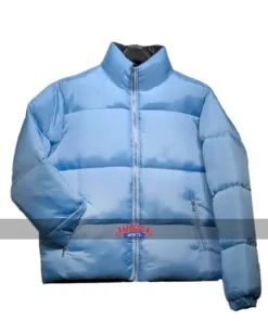 Front view of the Andy Cohen Puffer Jacket in light blue, featuring a full zipper closure, side pockets, and a cozy, insulated puffer design.