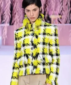 Gracie Abrams wearing a stylish Spring 2026 couture yellow jacket by America Jackets, front view.
