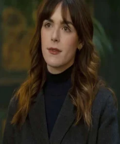 Kiernan Shipka Industry Coat featuring a premium black wool-blend finish and a high-status tailored silhouette for a sharp cinematic profile.