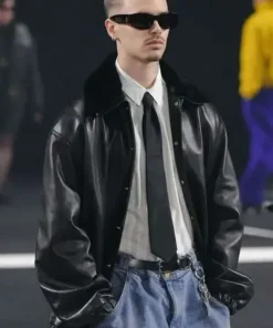 Front view of the PFW 2026 Romeo Beckham black leather jacket with zipper by America Jackets.