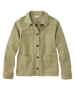 A woman wearing a navy blue stretch barn jacket by America Jackets, showing the front button closure.