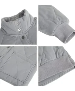 Design details of a Grey Dolman Quilted Jacket featuring the ribbed cuffs, high snap-button collar, and functional patch pockets for everyday wear.