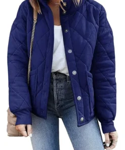 A stylish Womens Navy Dolman Quilted Jacket styled with jeans, highlighting the front button closure, side pockets, and relaxed dolman sleeve fit.