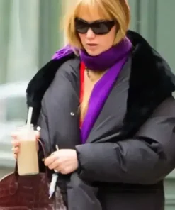 Jennifer Lawrence Puffer Coat featuring a premium black quilted design and a professional long length silhouette.