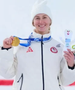 Close up of Elizabeth Lemley Winter Olympics 2026 Team USA Quilted Jacket featuring the ACG logo and Olympic team patch with a gold medal.