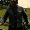 Jason Momoa wearing the wrecking crew jason momoa leather vest with custom biker patches and sunglasses while standing outdoors.