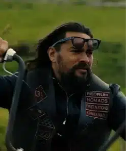Close-up of the wrecking crew jonny hale leather vest worn by Jason Momoa, showcasing the Redrum and Nomads patches on the chest.