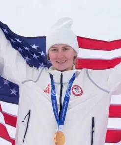 Gold medalist Elizabeth Lemley holding an American flag wearing the official Winter Olympics 2026 Team USA Elizabeth Lemley jacket.